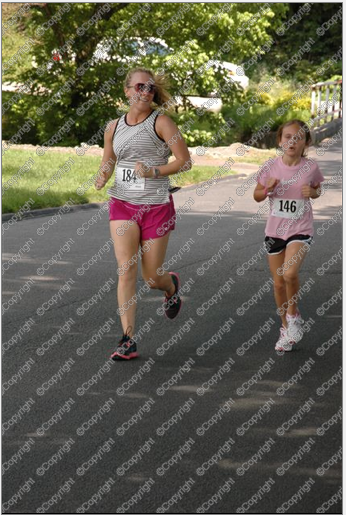 Me helping Callie to a 5K PR in May 2012